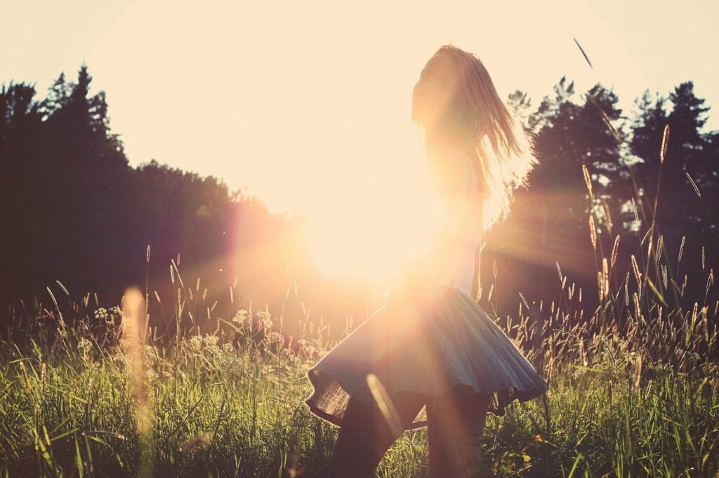 a woman in a field in new jersey considering integrative nutrition therapy