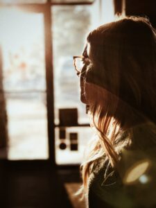 Woman spending time in reflection about stress management skills.