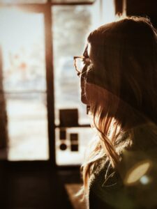 Woman spending time in reflection about stress management skills. 