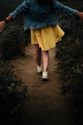 woman walking away thinking about how anxious thoughts are failing us