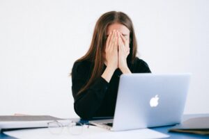 Stressed Woman Covering Her Face with Her Hands