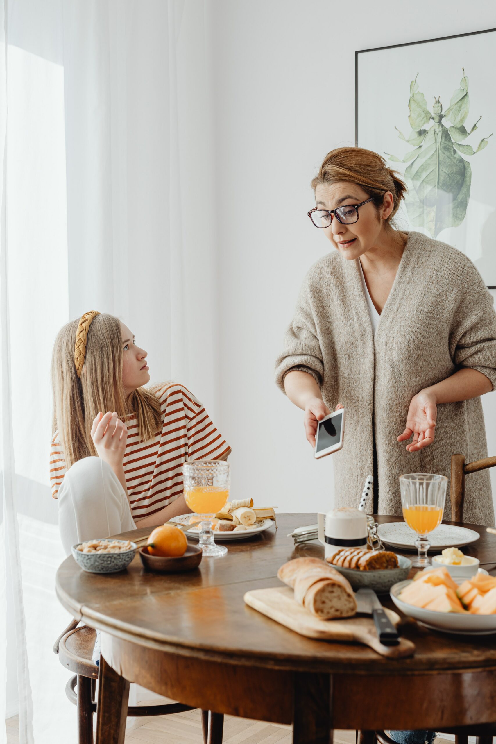 Mother and daughter arguing during breakfast