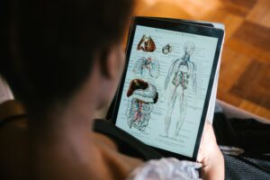 Photo of woman studying anatomy and learning about chronic stress 