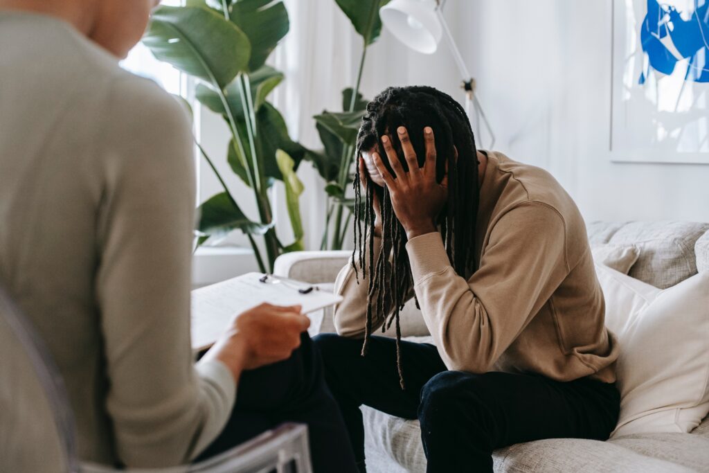 black man in therapy learning about how adverse childhood experiences have led to him feeling lost in life