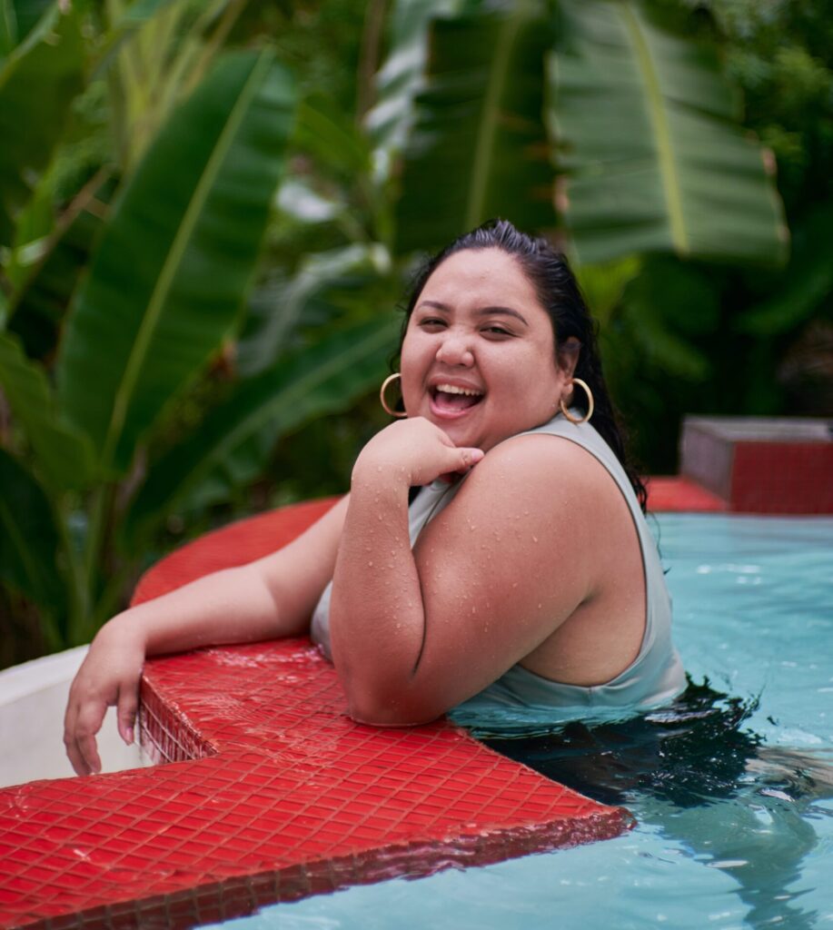 woman smiling in a swimming pool