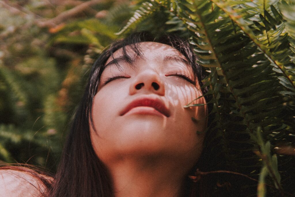 woman meditating and pondering holistic mind body connection