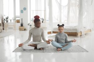 Woman and child sitting next to each other representing inner child healing