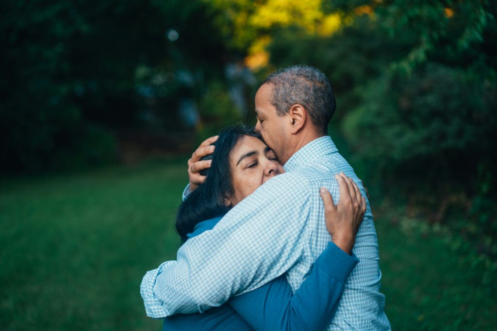 man and woman with secure attachment style hug