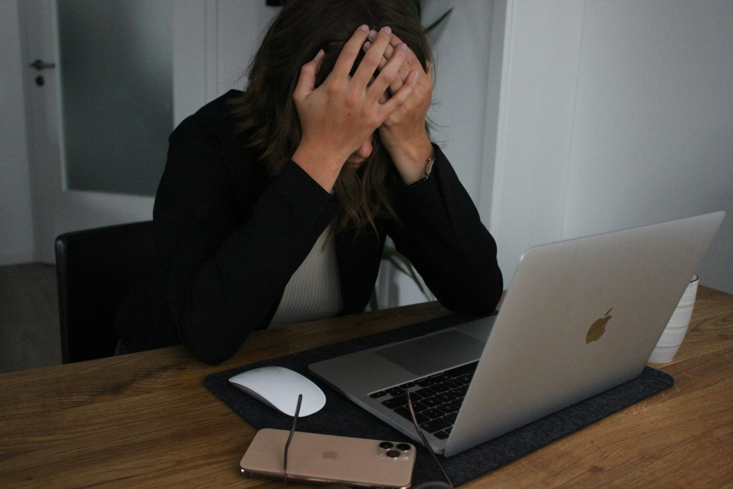 stressed woman at her computer worried about post-election anxiety