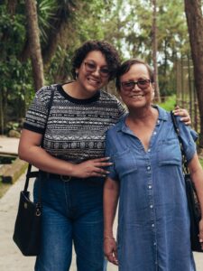 a first generation american mother and her daughter smiling for a photo, representing connection in immigrant families
